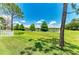 Expansive backyard with a picturesque pond view, perfect for relaxation and recreation at 11811 Fennemore Way, Parrish, FL 34219