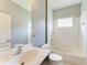 Well-lit bathroom with a large vanity and tub shower combination at 11811 Fennemore Way, Parrish, FL 34219