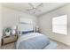 Cozy bedroom with a comfortable bed, stylish decor, and ample natural light at 11811 Fennemore Way, Parrish, FL 34219