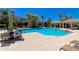 Large community pool with lounge chairs, shaded tables, and a covered gazebo, perfect for relaxing at 11811 Fennemore Way, Parrish, FL 34219