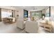 Open-concept living and dining areas with stylish furniture, neutral tones, and ample natural light at 11811 Fennemore Way, Parrish, FL 34219