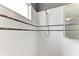Walk-in shower with tiled walls, built-in niche, and modern fixtures at 11811 Fennemore Way, Parrish, FL 34219