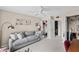 Comfortable bedroom with a gray sofa, closet space, and a neutral color palette creating a relaxing atmosphere at 1355 Rock Dove Ct # 1-2, Punta Gorda, FL 33950