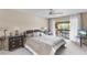 Serene main bedroom with a ceiling fan and sliding glass doors leading to a private balcony with waterfront views at 1355 Rock Dove Ct # 1-2, Punta Gorda, FL 33950