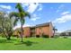 Exterior view with lush greenery and landscaping of this waterfront home at 1355 Rock Dove Ct # 1-2, Punta Gorda, FL 33950