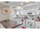 Well-lit kitchen with white cabinetry, efficient appliances, and functional layout at 1355 Rock Dove Ct # 1-2, Punta Gorda, FL 33950