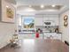 Bright kitchen with white cabinetry and appliances, featuring a window view and breakfast bar at 1355 Rock Dove Ct # 1-2, Punta Gorda, FL 33950