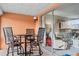 This lanai provides an additional seating area and a sliding glass door to the home's interior at 1355 Rock Dove Ct # 1-2, Punta Gorda, FL 33950
