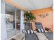 This lanai offers seating with lounge chairs and offers additional indoor living space at 1355 Rock Dove Ct # 1-2, Punta Gorda, FL 33950