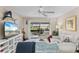 Inviting living room with a view to the lake, access to the balcony, and comfortable seating at 1355 Rock Dove Ct # 1-2, Punta Gorda, FL 33950