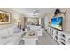 Bright living room featuring neutral tones, coastal decor, and plenty of natural light at 1355 Rock Dove Ct # 1-2, Punta Gorda, FL 33950