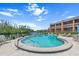 Community pool boasts waterfront views, poolside seating, and a refreshing escape at 1355 Rock Dove Ct # 1-2, Punta Gorda, FL 33950