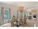 Chic dining room with a modern chandelier, lots of natural light, and stylish decor, ideal for Gathering meals at 1626 Ridgewood Ln, Sarasota, FL 34231
