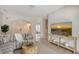 Inviting living room featuring a striped sofa, modern decor, and an open layout, creating a seamless flow to the entrance at 1626 Ridgewood Ln, Sarasota, FL 34231