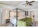 Main bedroom with a vaulted ceiling, light wood floor, sitting area and a slider to the lanai at 1626 Ridgewood Ln, Sarasota, FL 34231