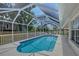 Inviting pool area enclosed with a screen, offering privacy and a relaxing outdoor space at 1626 Ridgewood Ln, Sarasota, FL 34231