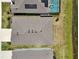 Birds eye view showing roof of home, adjacent homes, and pond in the community at 17536 Cantarina Cv, Bradenton, FL 34211