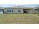 Expansive backyard with grassy lawn and covered patio perfect for outdoor entertaining at 17536 Cantarina Cv, Bradenton, FL 34211