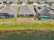Aerial view of the back of the house overlooking a serene pond, perfect for relaxation at 17536 Cantarina Cv, Bradenton, FL 34211