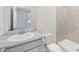 Bathroom with walk-in shower and granite vanity at 17536 Cantarina Cv, Bradenton, FL 34211