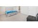 Comfortable bedroom featuring soft carpet, a queen bed with drawers, and an en-suite bath at 17536 Cantarina Cv, Bradenton, FL 34211