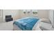 Light bedroom with carpet, windows, and decor at 17536 Cantarina Cv, Bradenton, FL 34211