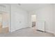 Neutral bedroom offers carpet floors, a closet, and connects to an ensuite bathroom at 17536 Cantarina Cv, Bradenton, FL 34211