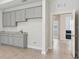 Bright bonus room with kitchenette, ideal for recreation or entertaining at 17536 Cantarina Cv, Bradenton, FL 34211
