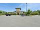 Exterior shot of community clubhouse featuring a well-maintained building and landscaping at 17536 Cantarina Cv, Bradenton, FL 34211