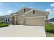 Charming single-story home with a two-car garage and stone accents and inviting curb appeal at 17536 Cantarina Cv, Bradenton, FL 34211