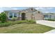 Charming single-story home with a two-car garage and stone accents, with beautiful landscaping at 17536 Cantarina Cv, Bradenton, FL 34211
