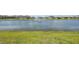 Scenic view of the pond featuring a fountain and neighboring houses at 17536 Cantarina Cv, Bradenton, FL 34211