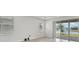 Bright room with tile floors, a view, and sliding glass doors at 17536 Cantarina Cv, Bradenton, FL 34211