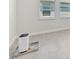 Bright interior room showcasing tile floors and natural light at 17536 Cantarina Cv, Bradenton, FL 34211