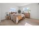 Comfortable bedroom with natural light, wood floors, and stylish decorative accents at 1801 W Saint Isabel St, Tampa, FL 33607