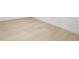 Light wood flooring with white baseboards adding charm to the room at 1801 W Saint Isabel St, Tampa, FL 33607
