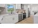 Bright, renovated kitchen with stainless steel appliances, quartz countertops, and modern cabinetry at 1801 W Saint Isabel St, Tampa, FL 33607