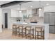 Modern kitchen featuring an island, stainless steel appliances, pendant lighting and white cabinetry at 1801 W Saint Isabel St, Tampa, FL 33607