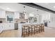Modern kitchen featuring an island, stainless steel appliances, pendant lighting and white cabinetry at 1801 W Saint Isabel St, Tampa, FL 33607