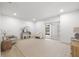 Bright, airy living area with neutral tones, stylish decor, and a sliding glass door at 1801 W Saint Isabel St, Tampa, FL 33607