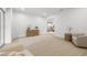 Bright living room featuring an open floor plan, light wood floors, and modern furnishings at 1801 W Saint Isabel St, Tampa, FL 33607