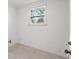 A small utility room featuring tiled floors, a window, and plumbing fixtures at 1801 W Saint Isabel St, Tampa, FL 33607