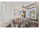 Dining area featuring an elegant table set and chandelier at 2152 Majestic Oaks Blvd, Clearwater, FL 33759