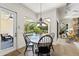 The dining nook overlooks the screened-in pool and patio area at 2152 Majestic Oaks Blvd, Clearwater, FL 33759