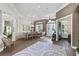 Elegant dining room with statement chandelier and adjacent living spaces at 2152 Majestic Oaks Blvd, Clearwater, FL 33759