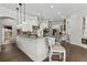 This open kitchen features granite countertops, an island, and lots of bar seating at 2152 Majestic Oaks Blvd, Clearwater, FL 33759