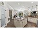 Bright kitchen boasts a granite island, stainless steel appliances, and opens to a dining nook at 2152 Majestic Oaks Blvd, Clearwater, FL 33759
