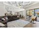 Open living space featuring coffered ceilings and access to the screened pool at 2152 Majestic Oaks Blvd, Clearwater, FL 33759