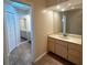 Neutral bathroom featuring double vanity, wall to wall mirrors, and ample cabinet storage at 2178 Calcutta Rd, Punta Gorda, FL 33983