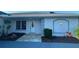 Exterior view of the front entrance with tiled walkway and well maintained landscaping at 2178 Calcutta Rd, Punta Gorda, FL 33983